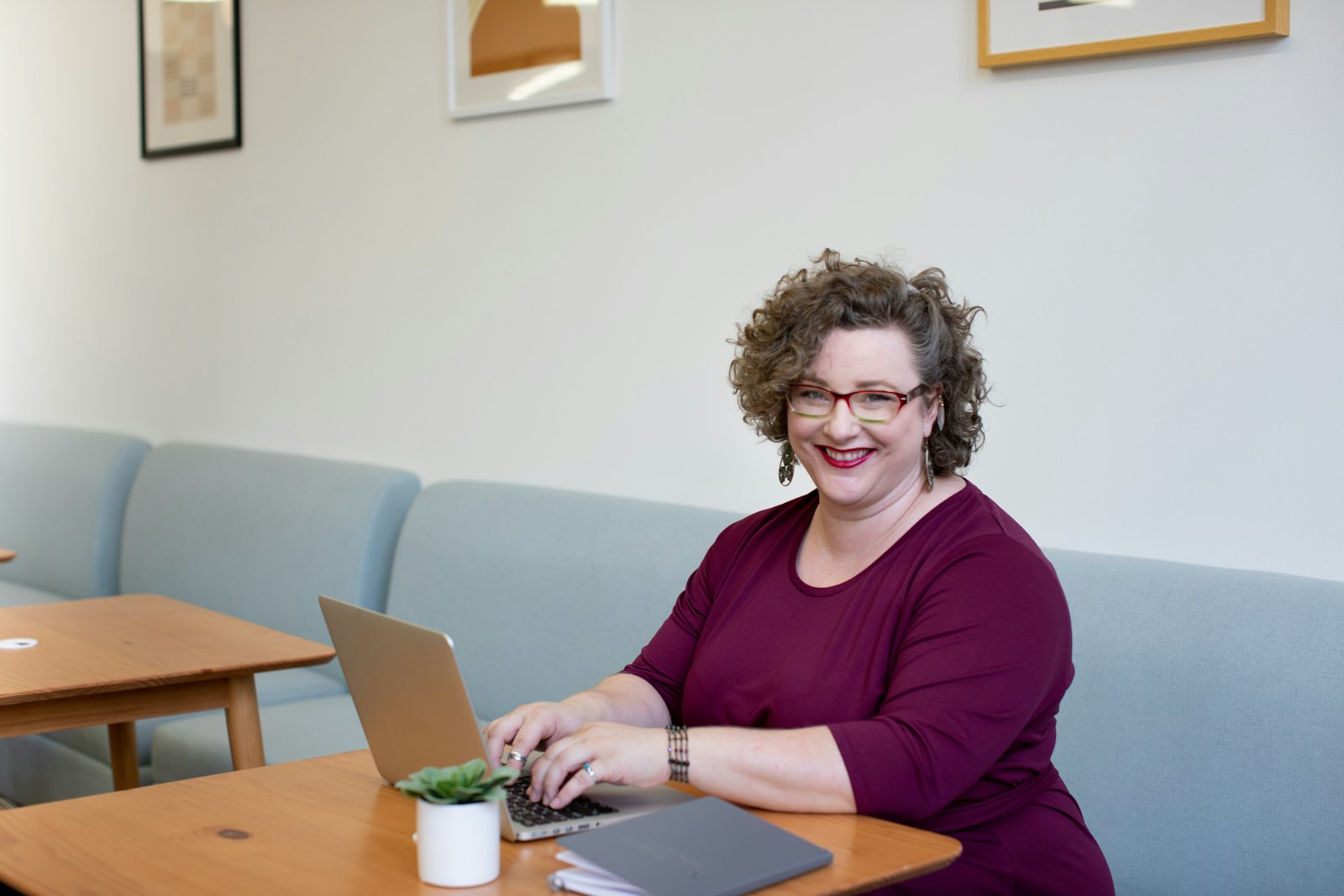 A professional working through interview preparation on a laptop