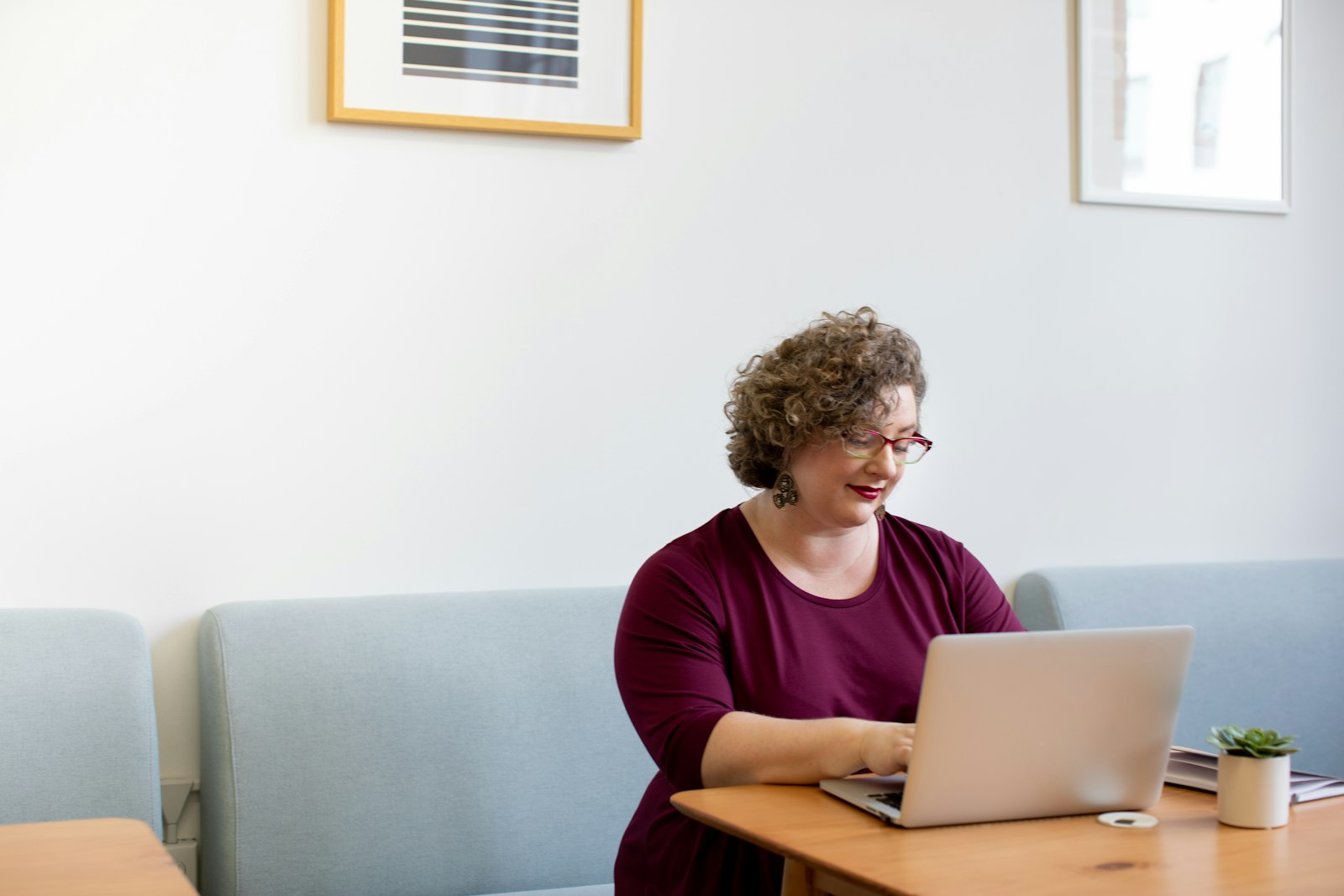 An experienced professional preparing for an interview on her laptop